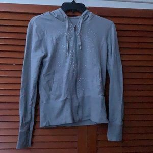 I am selling a Calvin Klein jacket it is gray an fit is a size small